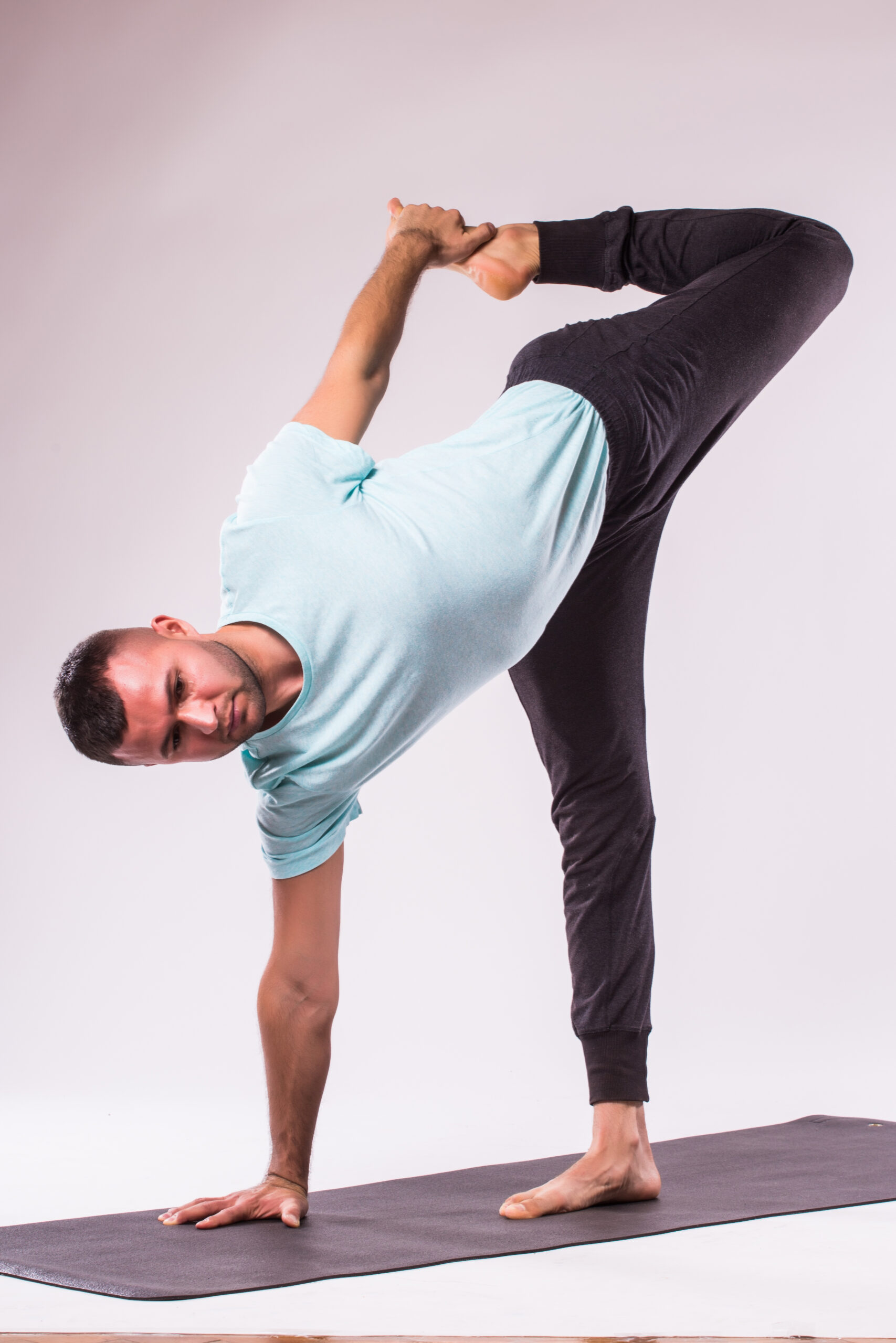 concept yoga handsome man doing yoga exercise isolated white background scaled